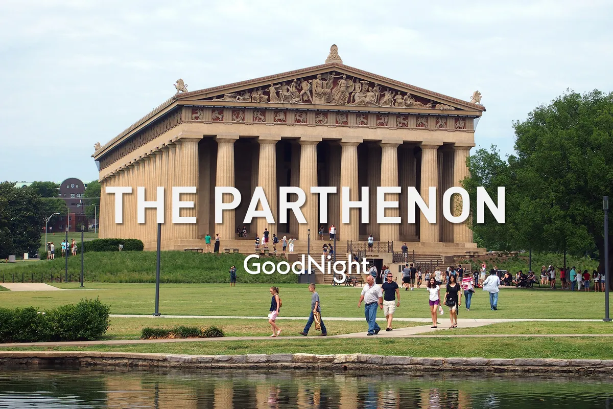 The Parthenon—a full-scale replica of the ancient Greek structure—stands tall in Centennial Park, with people walking on the surrounding lawn and its reflection shimmering in the water nearby. The scene feels lively and welcoming, perfect for group outings or photo opportunities.