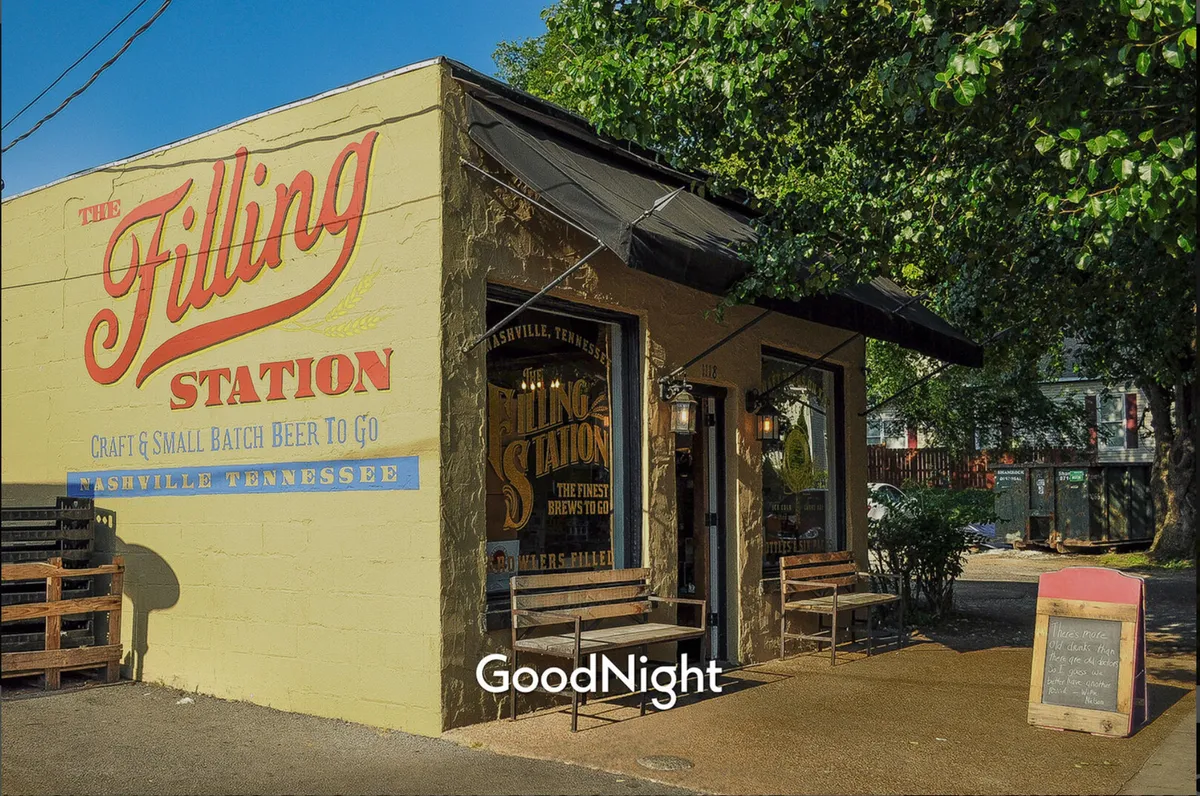 The exterior of The Filling Station, with a prominent sign, inviting outdoor seating, and large windows displaying craft beer selections. The scene radiates friendliness and the anticipation of a casual hangout spot.