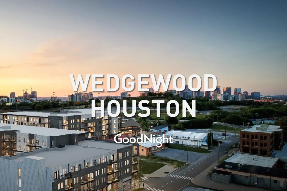 Contemporary apartment buildings frame a distant city skyline, bathed in soft sunset hues. The tranquil mood and visible community spaces reflect a balance of relaxation and adventure close to home.